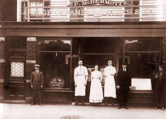 Photo of Peter and Rose McDermott in front of their tavern, ca. 1919